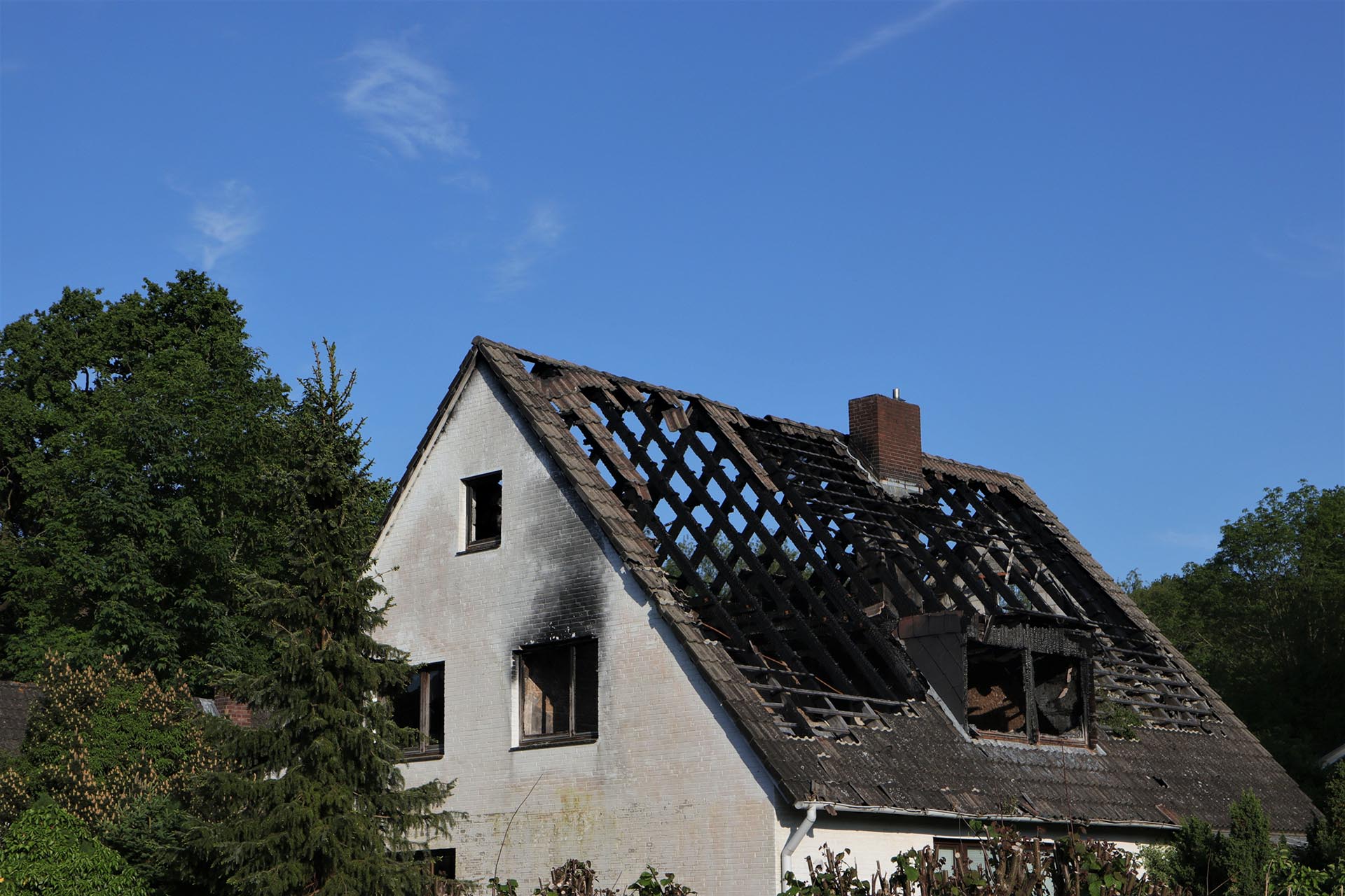 house fire, burned roof truss, demolotion work, fire damage