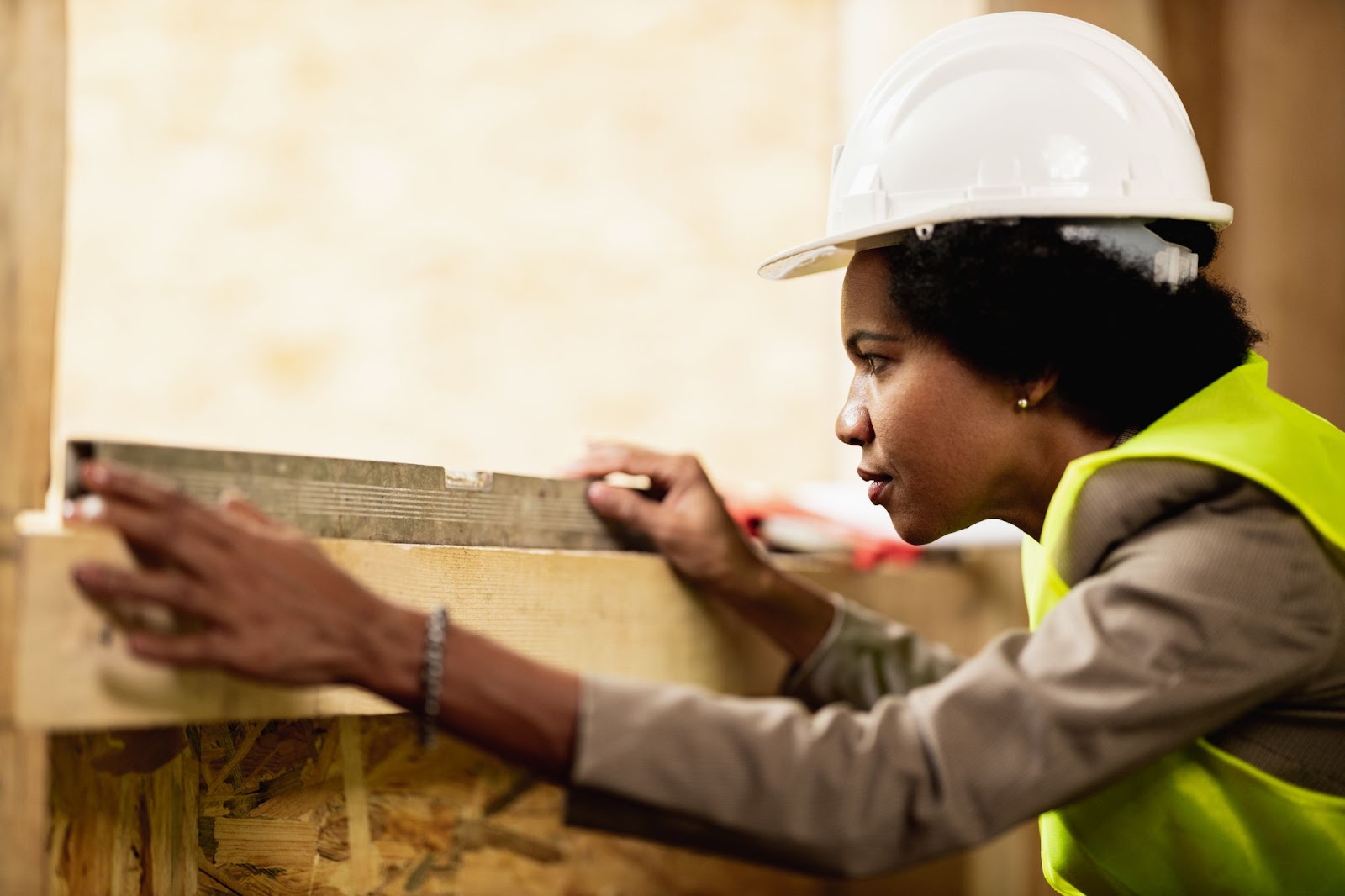 A woman architect is checking the quality of the materials. 