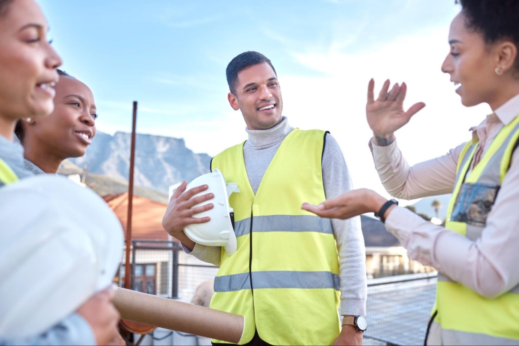 A team of architects is having a meeting with some contractors