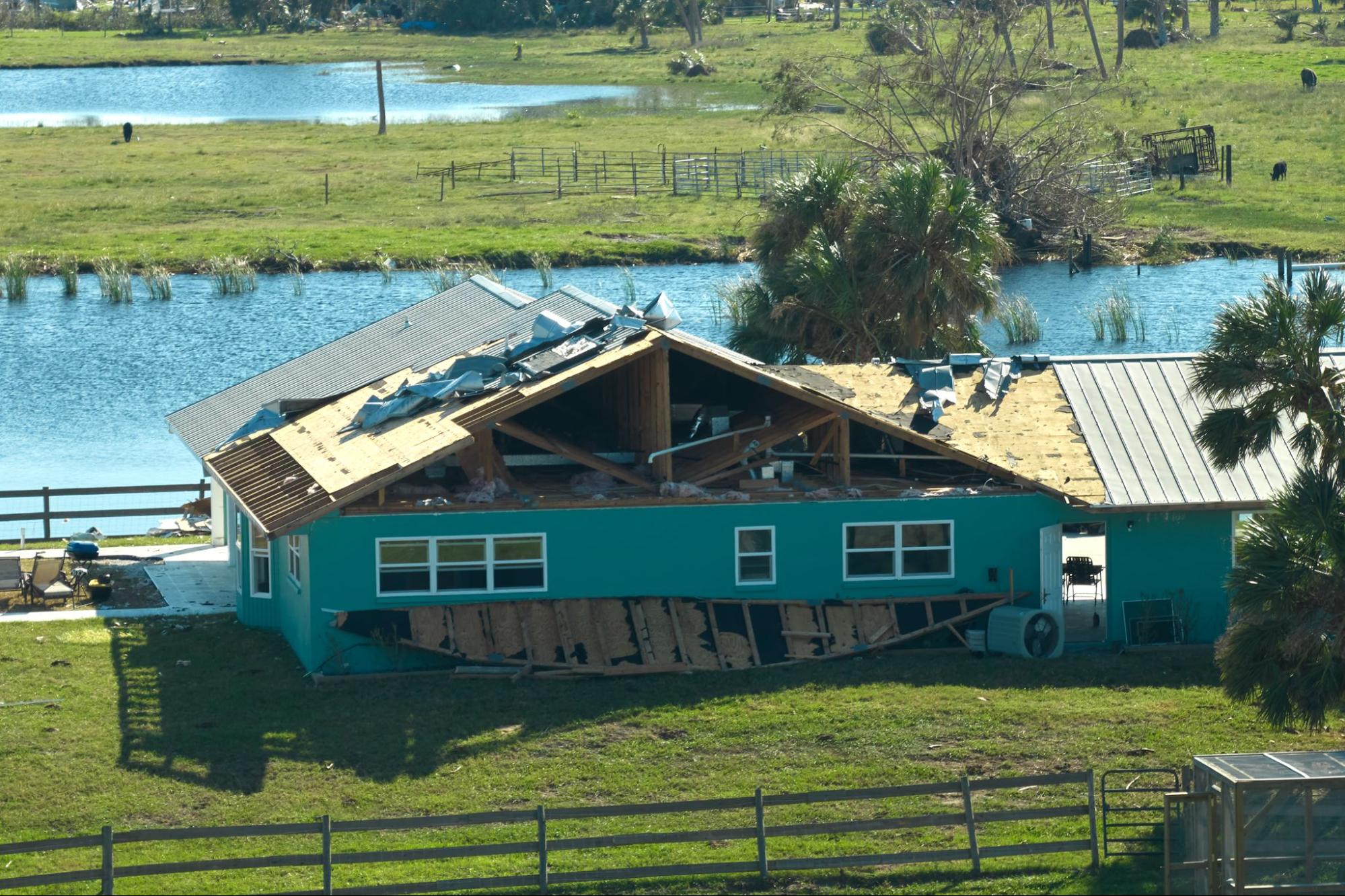 A home with a severely damaged roof.