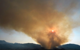 Smoke with mountains in the background.